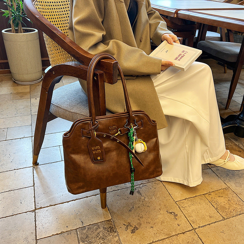 Women's Retro Hand-held Advanced Exquisite Commuter Bags