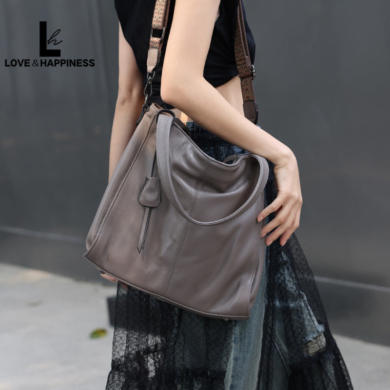 Women's First Layer Cowhide Simple Solid Color Commute Tote Bags