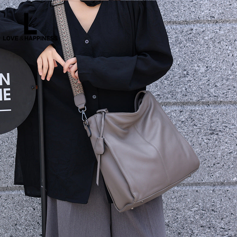 Women's First Layer Cowhide Simple Solid Color Commute Tote Bags
