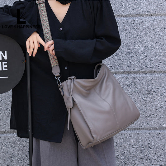 Women's First Layer Cowhide Simple Solid Color Commute Tote Bags
