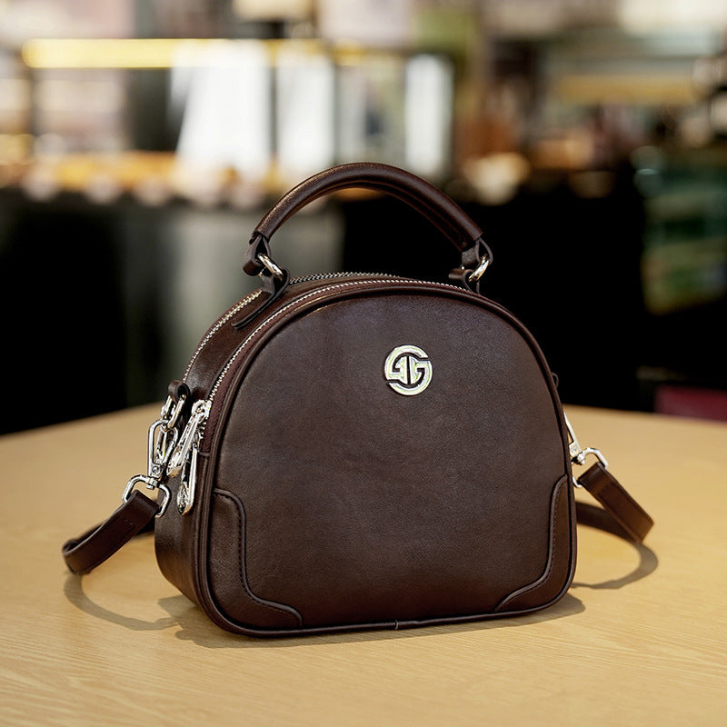 Women's Cow Leather Solid Color Round Fashion Crossbody Bags