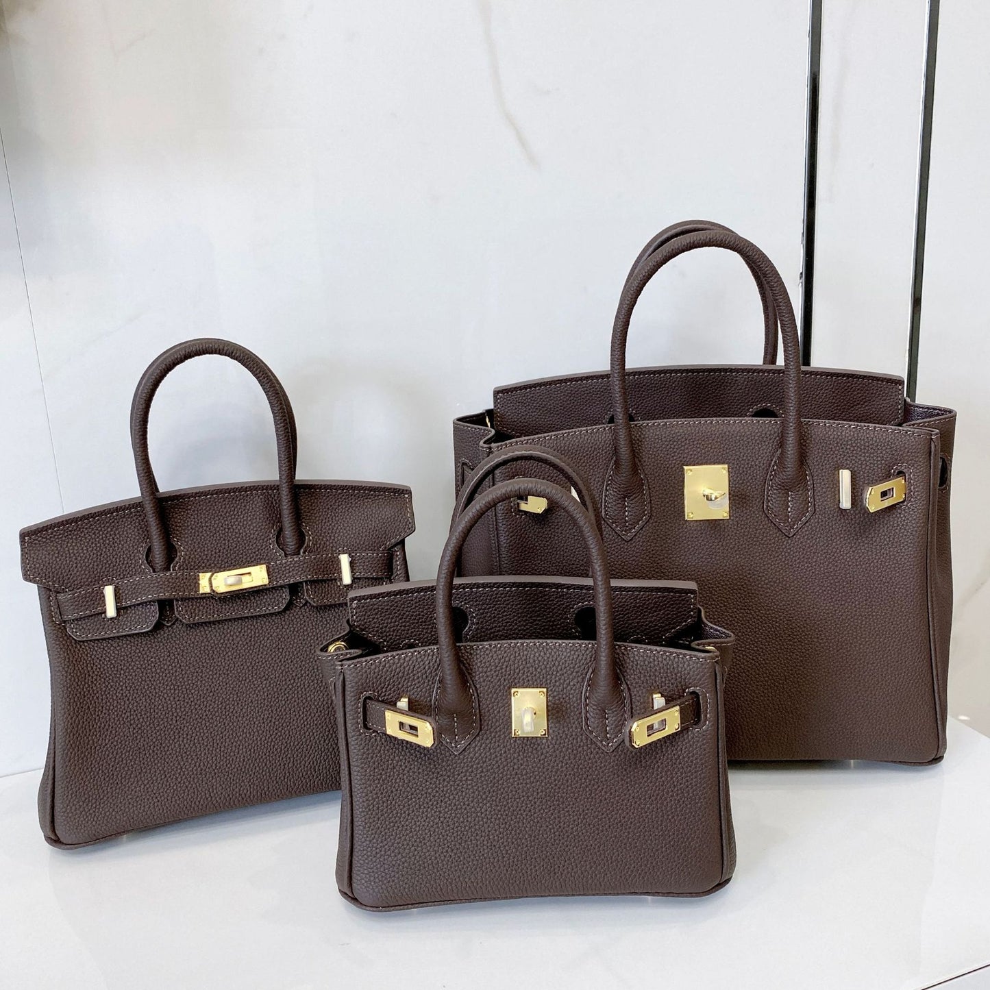 Women's First Layer Cowhide Lychee Pattern Gold Genuine Handbags