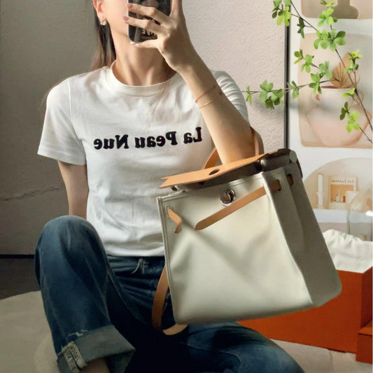 Women's Kelly Cowhide Stitching Canvas Large Capacity Handbags